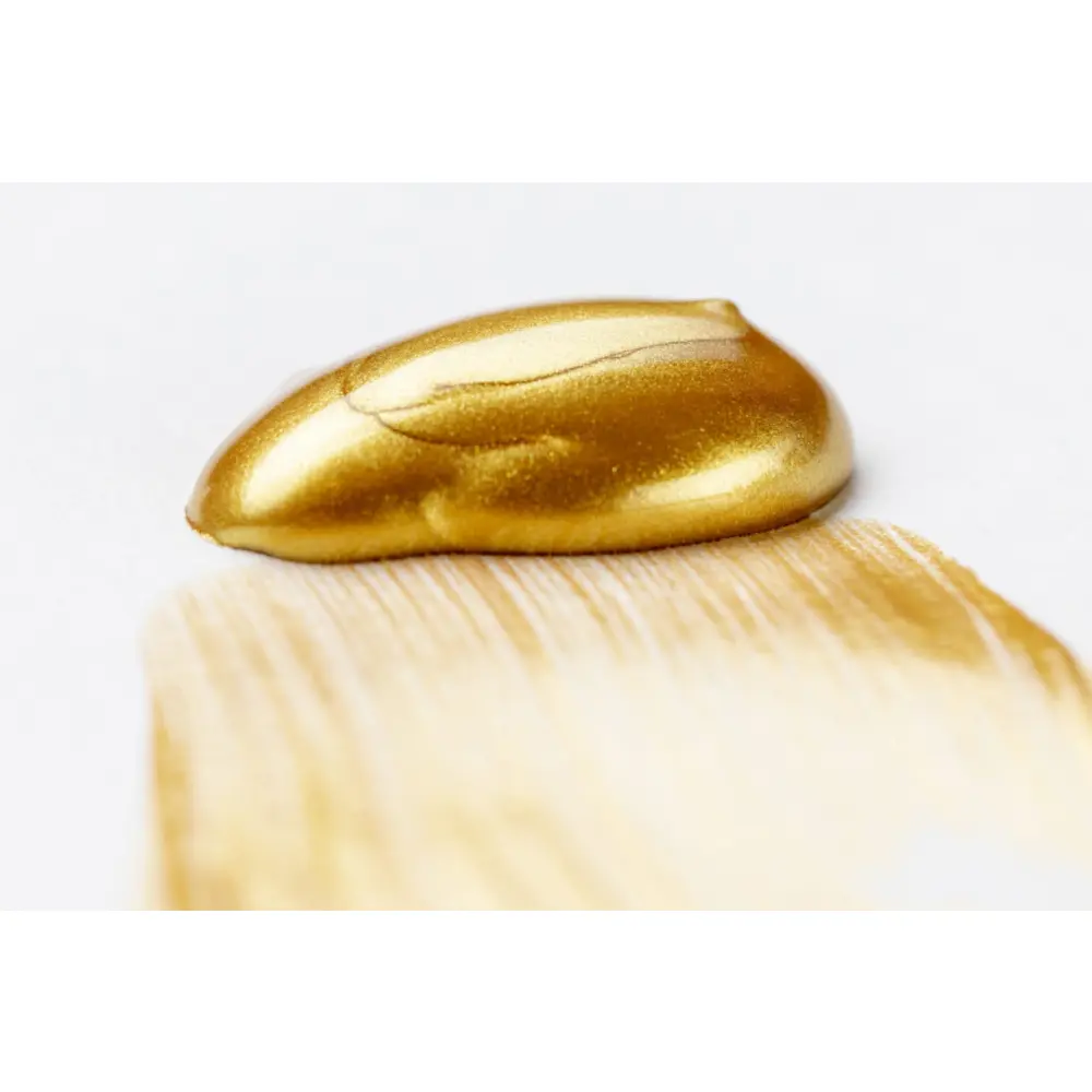 golden-glittery-paint-white-table-scaled